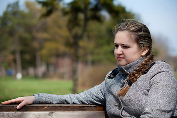 Image showing The girl longs on the nature