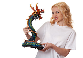 Image showing beautiful girl with a wooden dragon