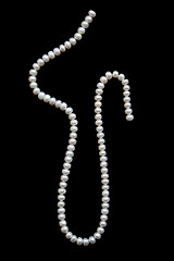 Image showing White pearls on a black velvet 