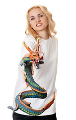 Image showing beautiful girl with a wooden dragon