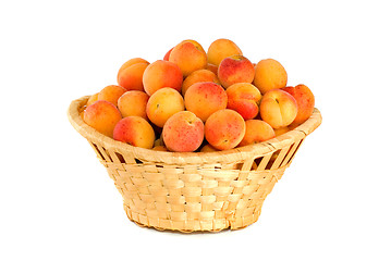 Image showing Wicker basket filled with apricots