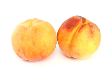 Image showing Pair of orange peaches