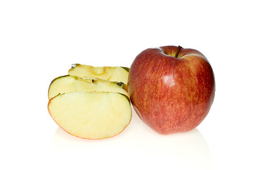 Image showing One whole red apple and few slices