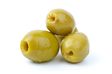 Image showing Three pitted marinated green olives close-up