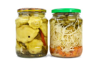 Image showing Glass jars with marinated cymblings and vegetable assortment