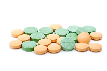 Image showing Orange and green tablets