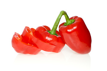 Image showing Sliced and whole red sweet peppers