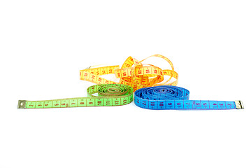 Image showing Three measuring tapes of different colors