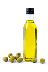 Image showing Bottle of olive oil and some olives