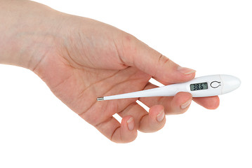 Image showing Hand holding digital medical thermometer