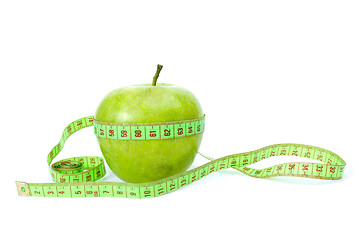 Image showing Green apple and measurement tape