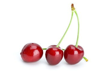 Image showing Three red cherries