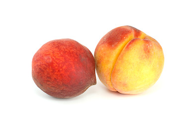 Image showing Orange and red peaches