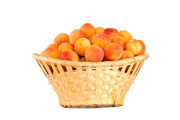 Image showing Wicker basket filled with apricots