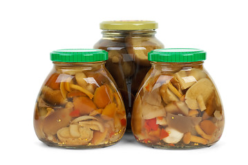 Image showing Glass jars with marinated mushrooms