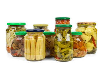 Image showing Glass jars with marinated vegetables and mushrooms