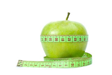 Image showing Green apple and measurement tape