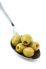 Image showing Five marinated pitted green olives in the metal spoon