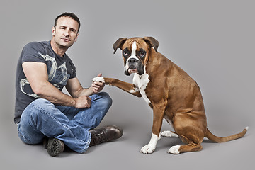 Image showing handsome muscle man with his dog