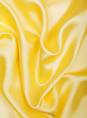 Image showing Smooth elegant golden silk as background 