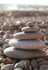 Image showing Water rounded stones on stone