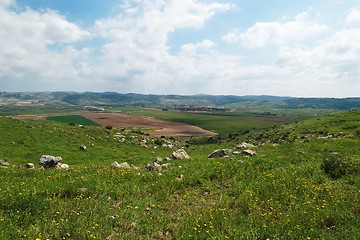 Image showing Valley with green and brown fields