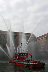 Image showing Fireboat flush in the air.