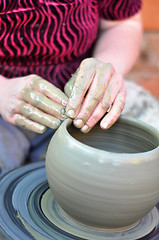 Image showing hands of a potter