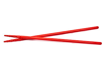 Image showing Red chopsticks isolated on white background 