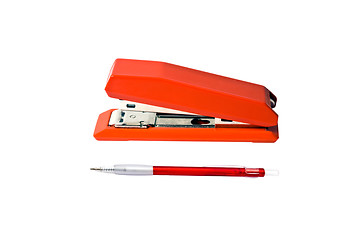 Image showing Red stapler and pen