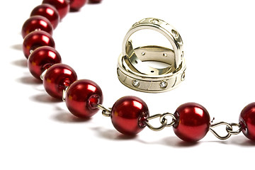 Image showing Beautiful red string of beads and rings