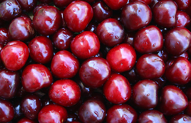 Image showing Wet ripe cherries as background