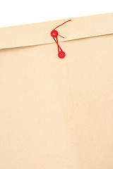 Image showing Manila envelope with red string