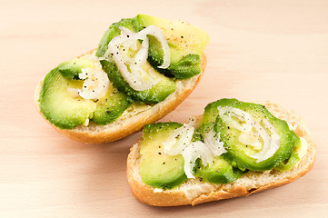 Image showing Sandwich with avocado on a wooden board 