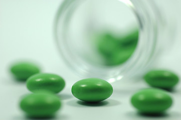 Image showing Green Pills with Glass