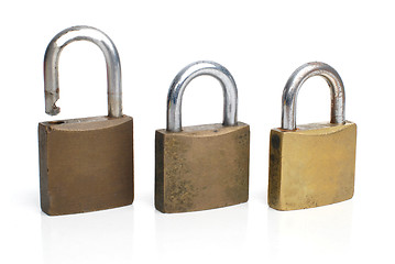 Image showing Three security gold locks