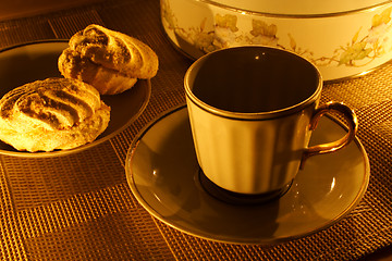 Image showing a cup of tea with zephyr on candle light
