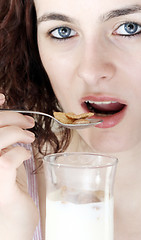 Image showing Young people eating milk with cereals