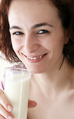 Image showing Young people eating milk with cereals