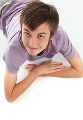 Image showing Smiling boy looking up