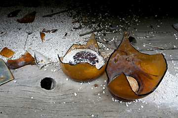 Image showing broken old bottle on shelf