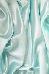 Image showing Smooth elegant blue silk as background 