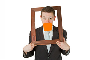 Image showing Businessman with wooden frame