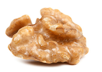Image showing half peeled walnut closeup