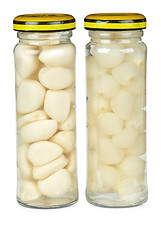 Image showing Glass jars with marinated garlic and onions