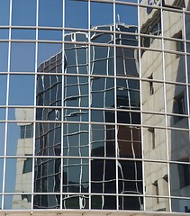Image showing Office building reflection in another building