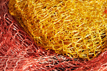 Image showing Yellow and red plastic mesh