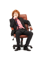 Image showing young businessman sitting in chair