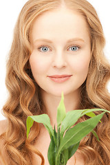 Image showing woman with green sprout