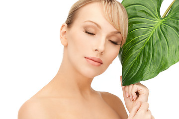 Image showing woman with green leaf